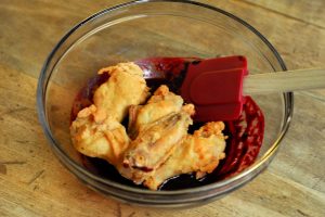 Blackberry Chipotle Hot Wings from A Duck's Oven. A twist on the traditional hot wing by using a homemade blackberry chipotle sauce!