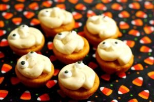 Pumpkin Ghost Cupcakes from A Duck's Oven. These mini pumpkin ghost cupcakes are adorable for Halloween (or any other reason!) and so easy to make!