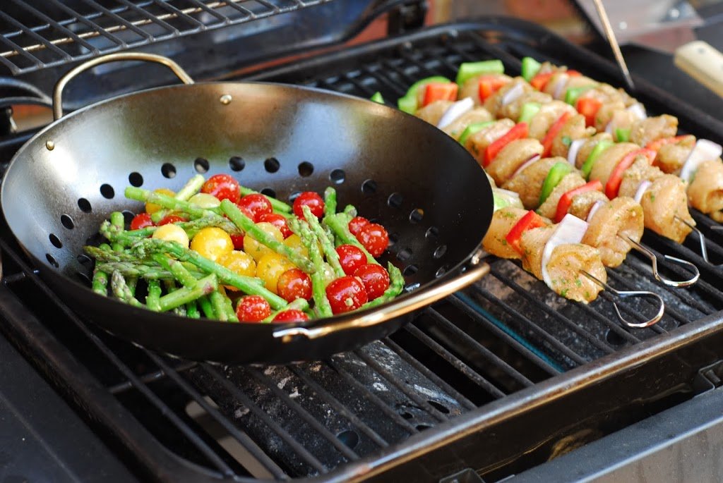 chicken kebabs and vegetables on the grill