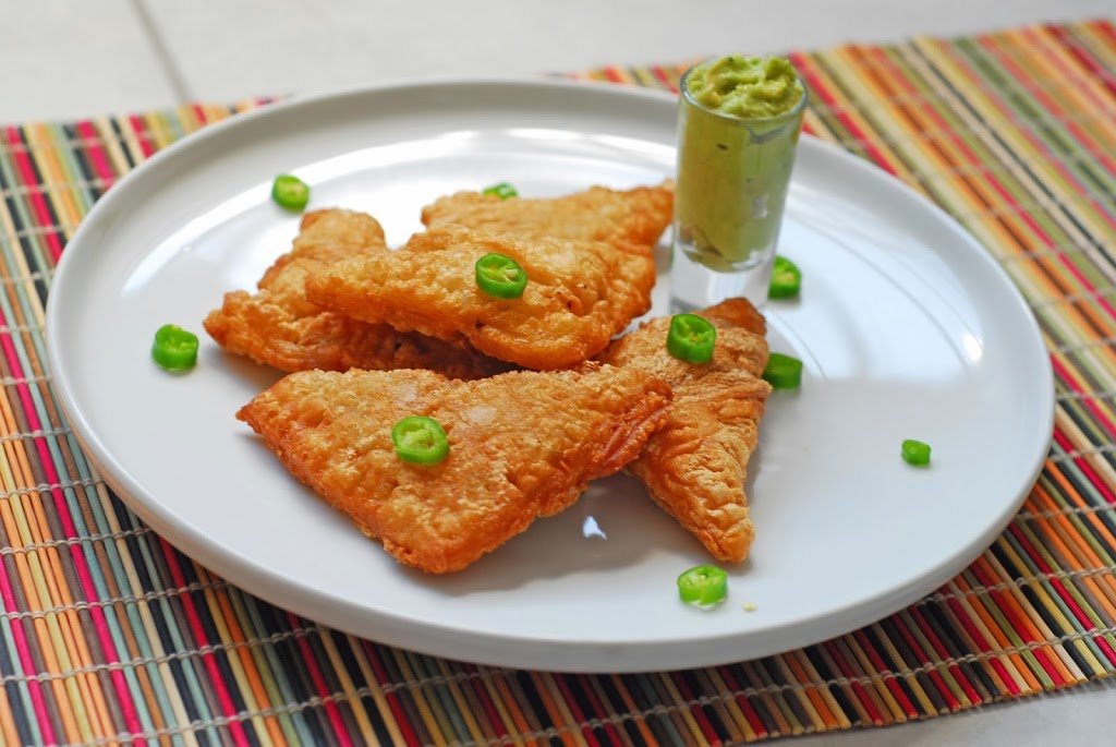 Lamb Samosas from A Duck's Oven. Samosas stuffed with spiced lamb and dipped in an avocado sauce.