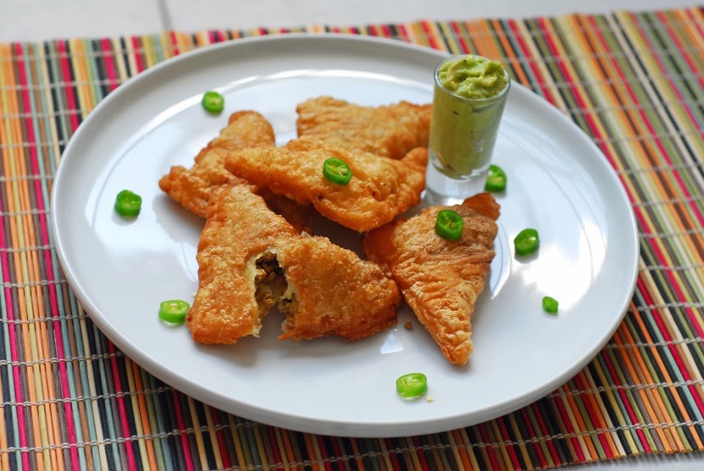 Lamb Samosas from A Duck's Oven. Samosas stuffed with spiced lamb and dipped in an avocado sauce.
