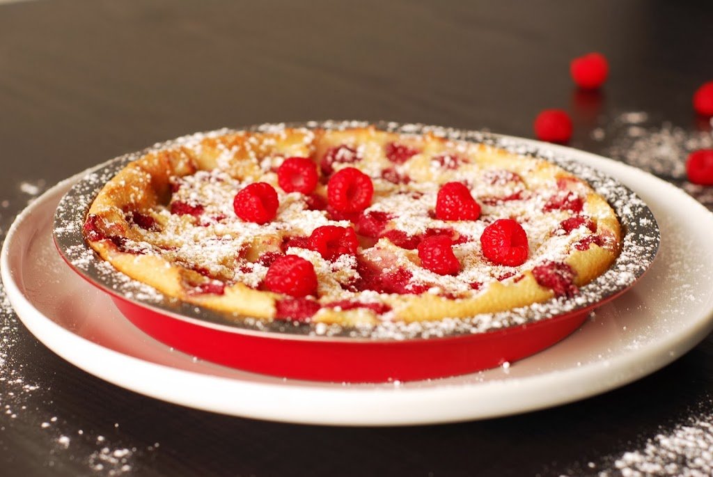 Raspberry and Coconut Clafoutis from A Duck's Oven. Custard meets pancake for this raspberry and coconut clafoutis. Excellent for breakfast or dessert!