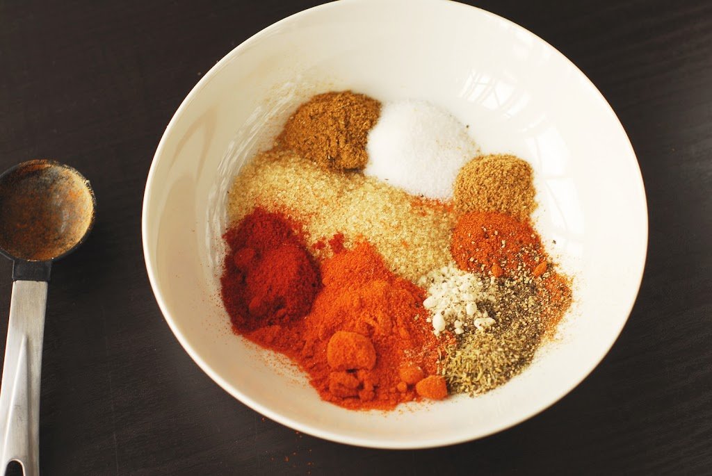 Spices in a white bowl for pulled pork dry rub