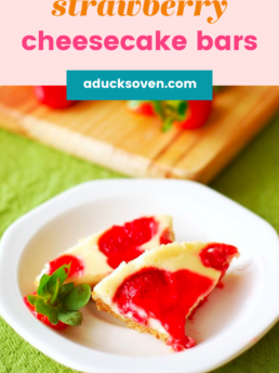 Strawberry Cheesecake bars sliced on a white round plate.