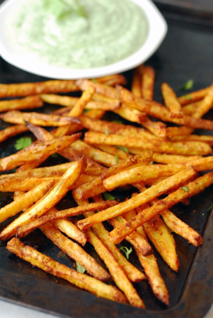 Crispy, oven-baked curry fries served with a cilantro mint yogurt dipping sauce from A Duck's Oven. Perfect as an appetizer or a side!