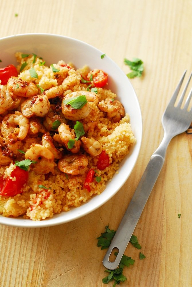 Spicy Shrimp and Couscous from A Duck's Oven. Shrimp seared in butter, lemon, and garlic over couscous cooked with jalapeños & grape tomatoes. Ready in 15 minutes!