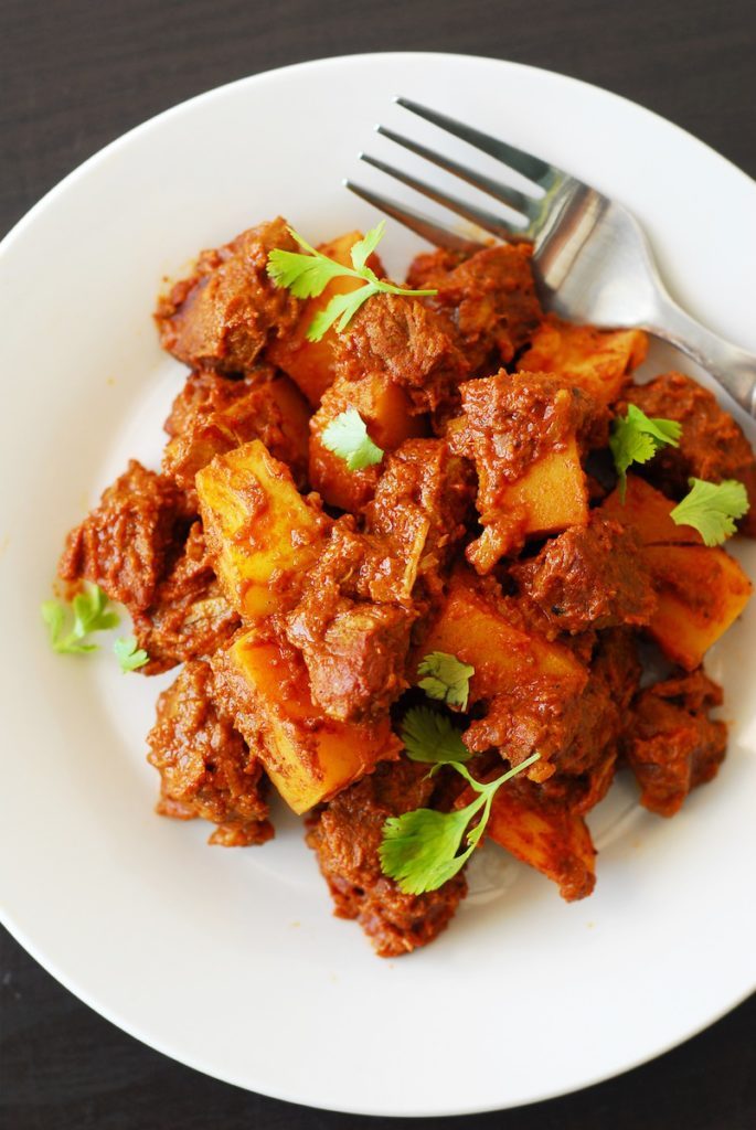 Lamb Vindaloo from A Duck's Oven. A spicy and flavorful meal that can be cooked on the stove or in a Dutch oven.