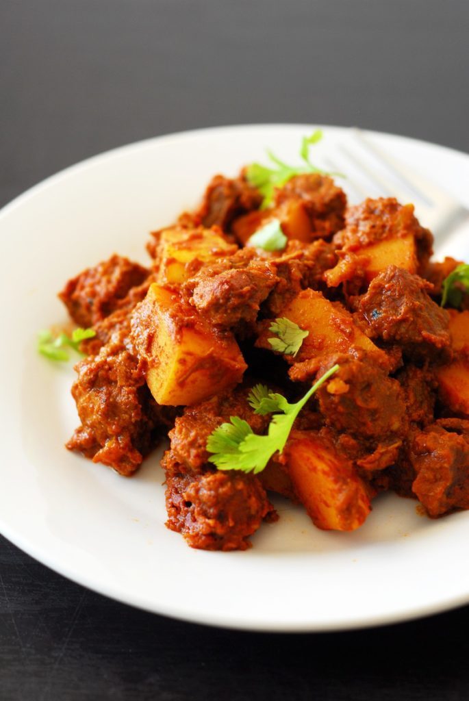 Lamb Vindaloo from A Duck's Oven. A spicy and flavorful meal that can be cooked on the stove or in a Dutch oven.