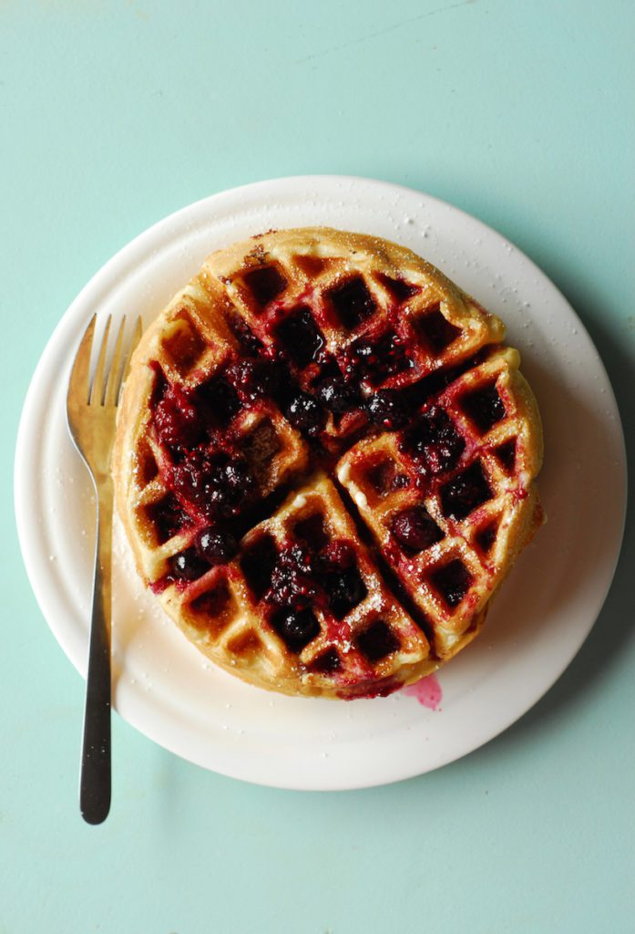 Cheesecake Stuffed Waffles with Berry Syrup from A Duck's Oven. Fluffy Belgian waffles stuffed with cheesecake filling and topped with berry syrup. The brunch to end all brunches!