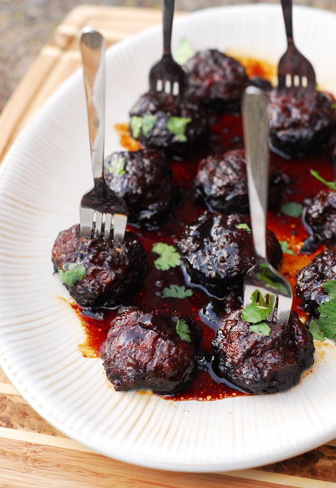 Crockpot Teriyaki Chicken Meatballs from A Duck's Oven. These super easy to make meatballs are full of teriyaki, ginger, and cilantro flavor! Great as an app or over rice.