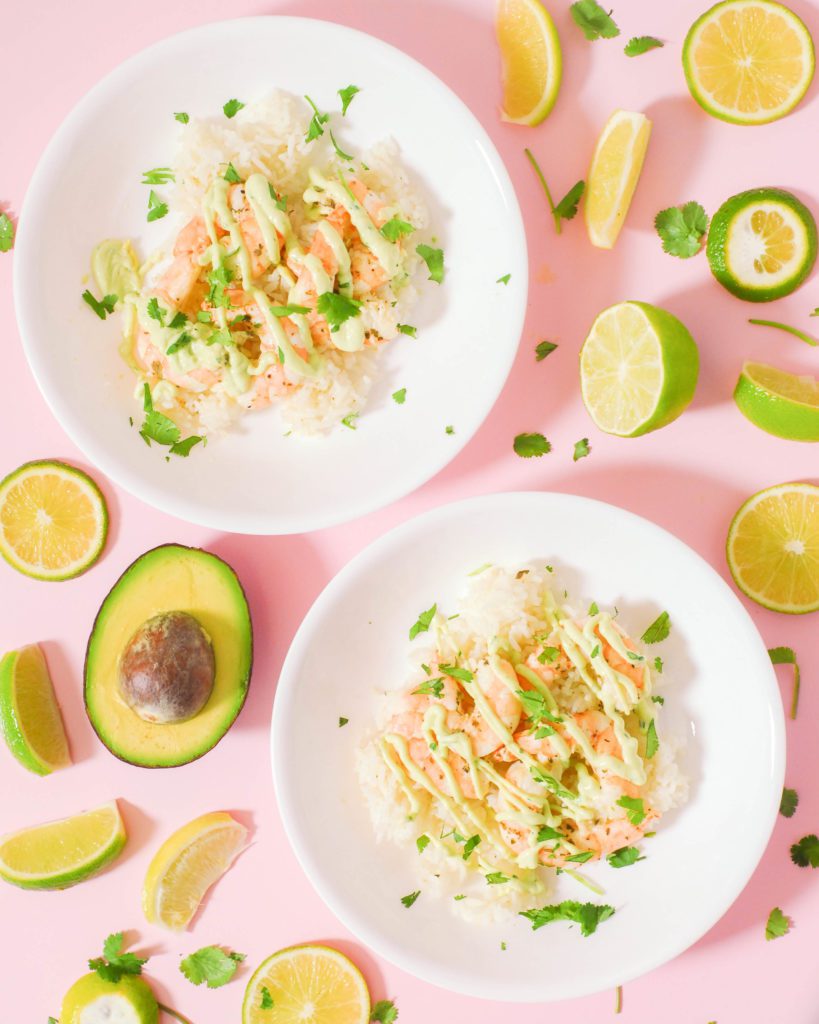 Sous Vide Cilantro Lime Shrimp served over rice on white plates