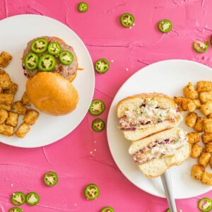 Jalapeno Stuffed Burgers on a pink background