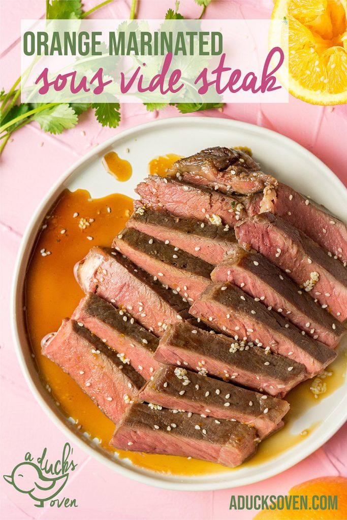 sous vide steak on a white plate with orange sauce and sesame seeds 