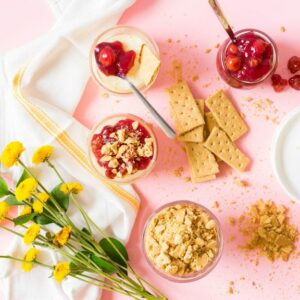 Individual sous vide cheesecake servings on a pink background