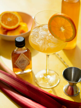 Cocktail ingredients on yellow background