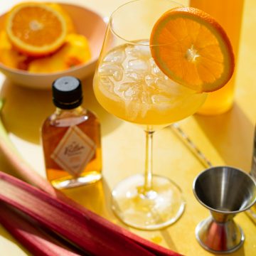 Cocktail ingredients on yellow background