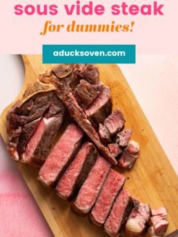 sous vide medium rare steak sliced on a wooden cutting board.