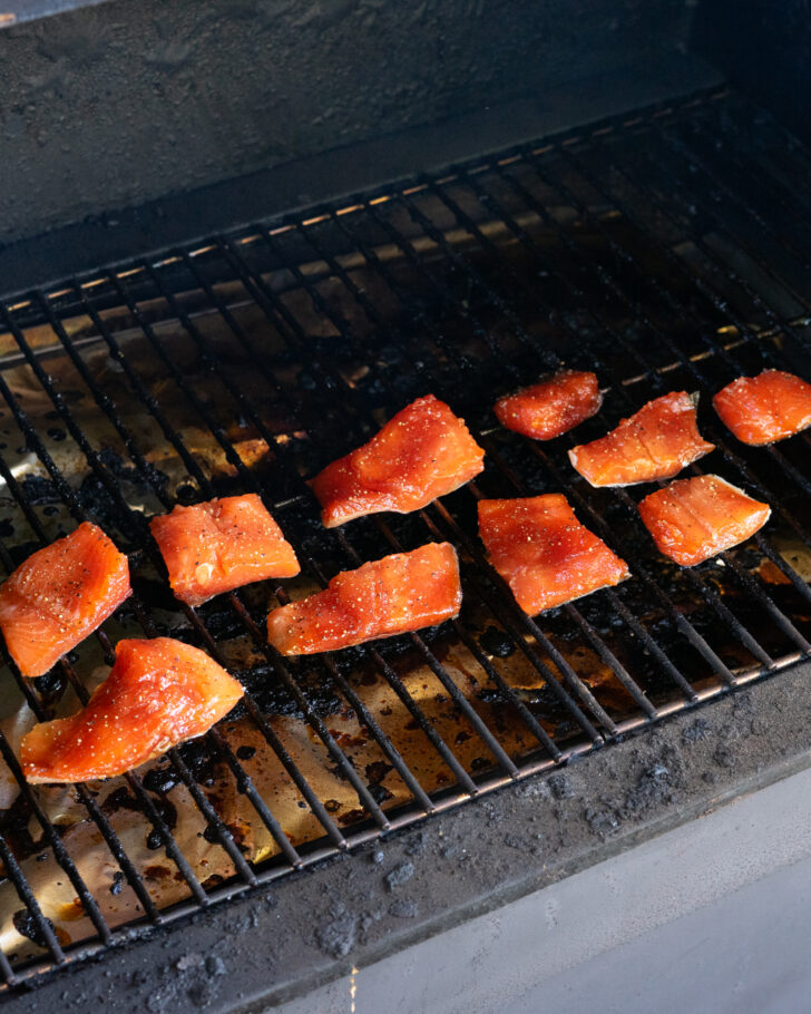 Raw rainbow trout on pellet smoker.